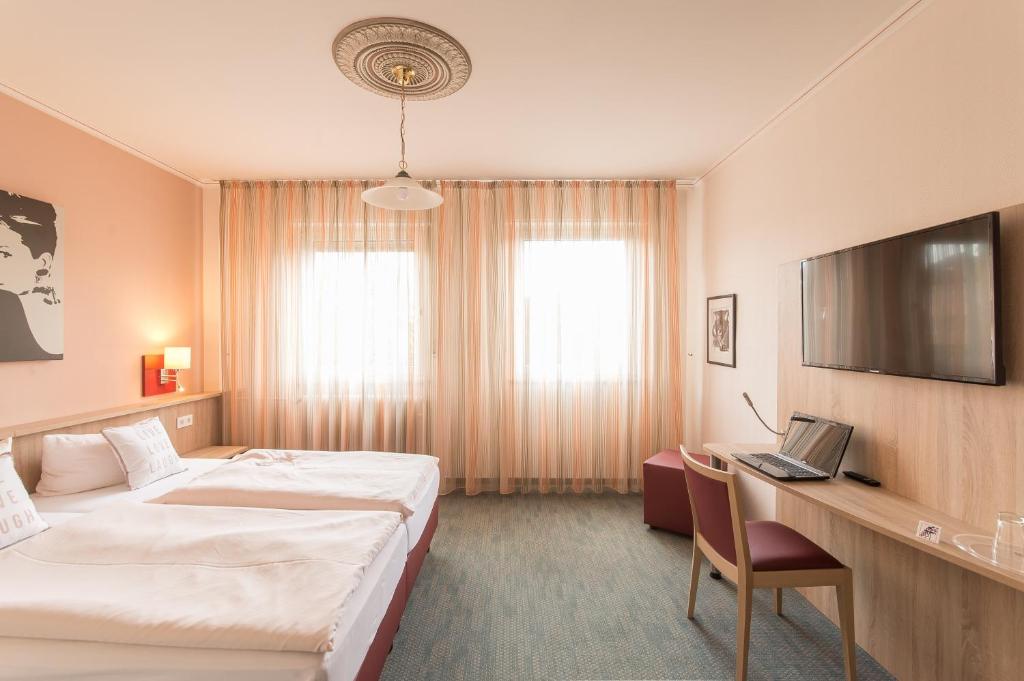 TV a/nebo společenská místnost v ubytování Hotel Leander