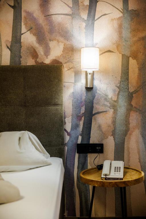 Postel nebo postele na pokoji v ubytování Hotel Landhaus Carla
