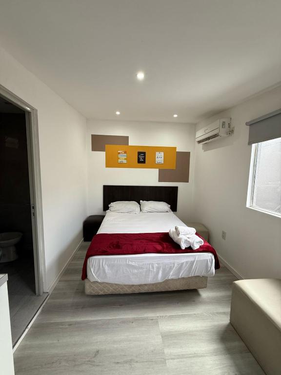 Llit o llits en una habitació de Apartamentos Centro