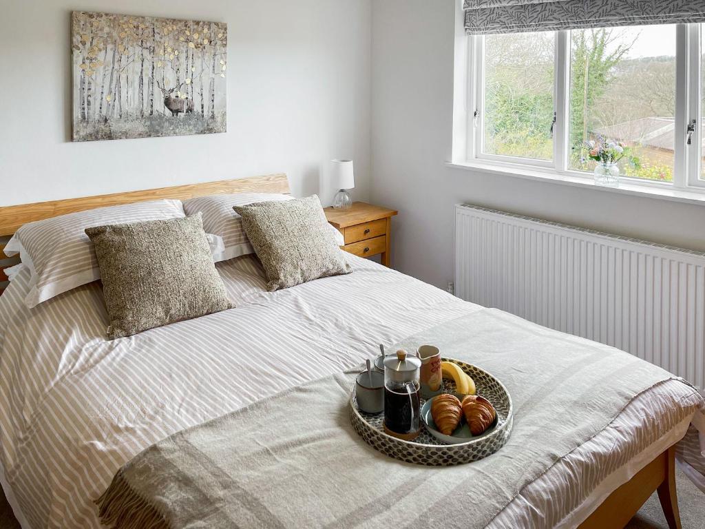 Postel nebo postele na pokoji v ubytování Elizabeth Cottage