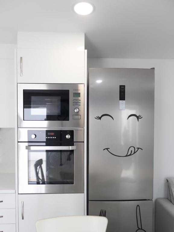 Kuchyň nebo kuchyňský kout v ubytování Casa de Praia Daniel 2