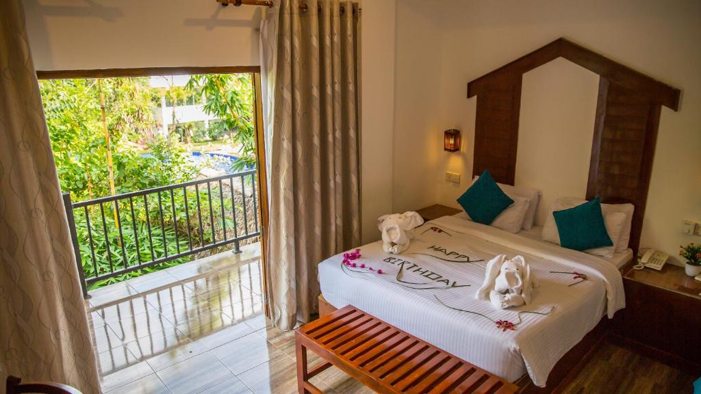 Postel nebo postele na pokoji v ubytování Sundaras Family Suites