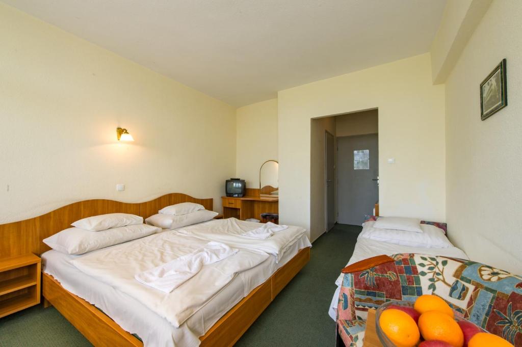 Postel nebo postele na pokoji v ubytování Hotel Nostra