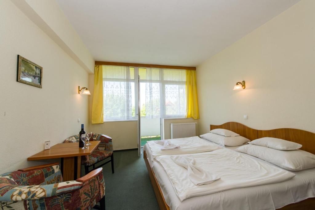 Postel nebo postele na pokoji v ubytování Hotel Nostra