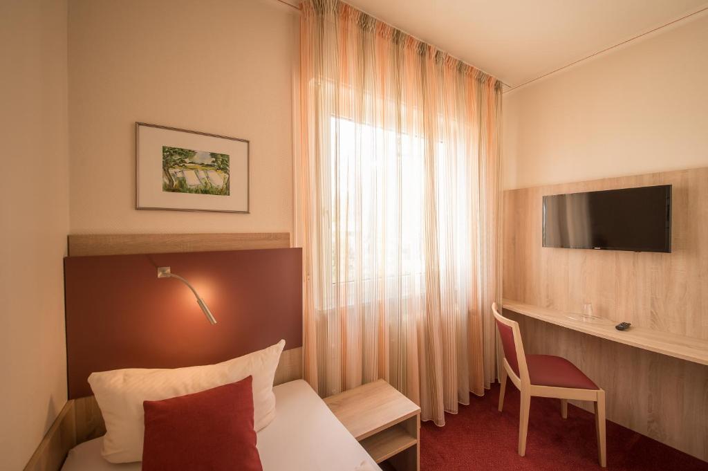 TV a/nebo společenská místnost v ubytování Hotel Leander