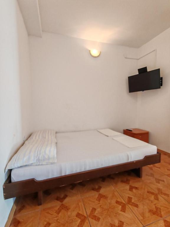 Postel nebo postele na pokoji v ubytování Apartments Mediterano