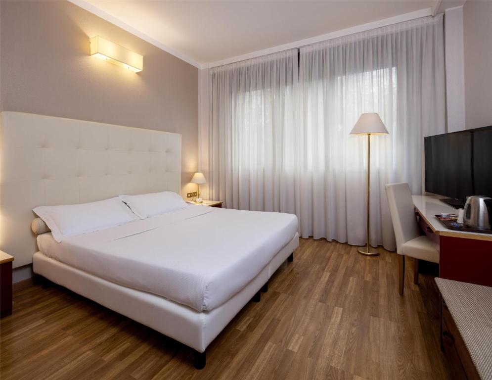 Łóżko lub łóżka w pokoju w obiekcie Best Western Air Hotel Linate