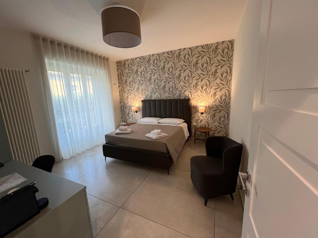 Postel nebo postele na pokoji v ubytování Annunziatella Suite & Rooms