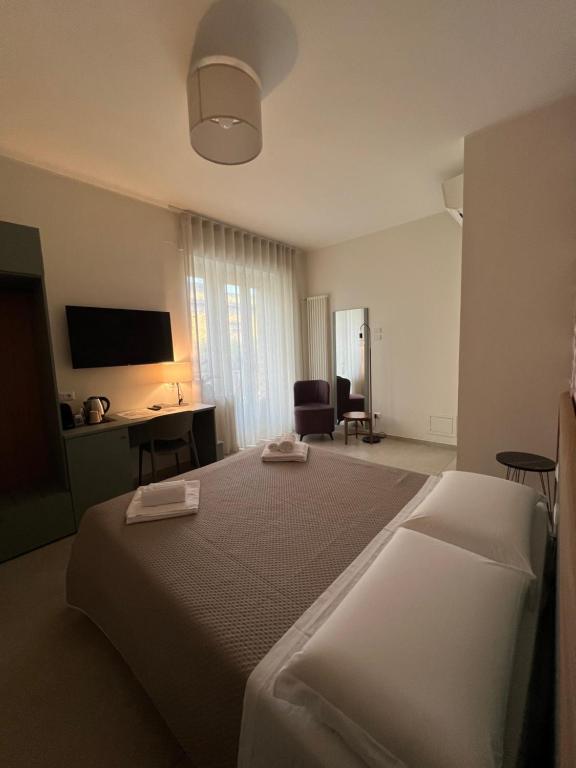 Postel nebo postele na pokoji v ubytování Annunziatella Suite & Rooms