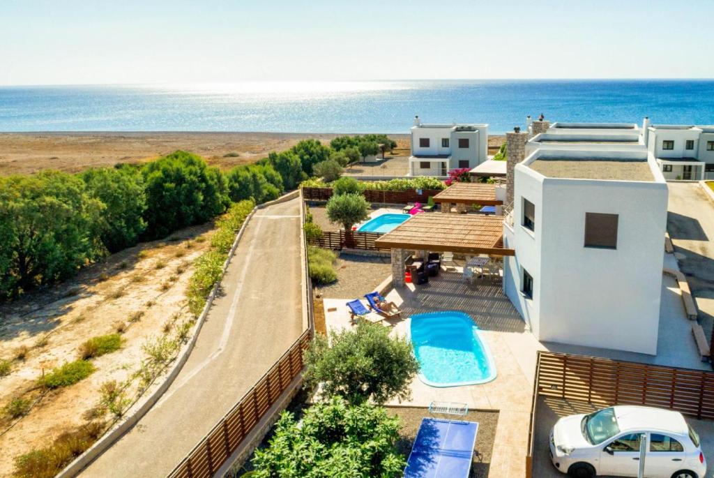 an aerial view of a resort with the ocean at Villa Dias in Lachania