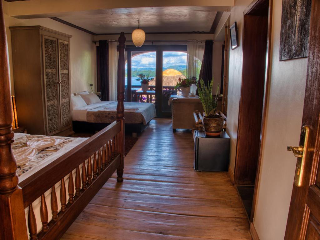 Postel nebo postele na pokoji v ubytování Birdnest Resort