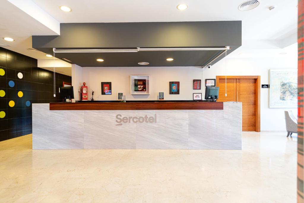 a sign for a scrabili counter in a lobby at Sercotel Riscal in Puerto Lumbreras
