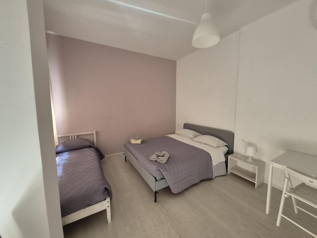 Postel nebo postele na pokoji v ubytování Il Guasco Rooms