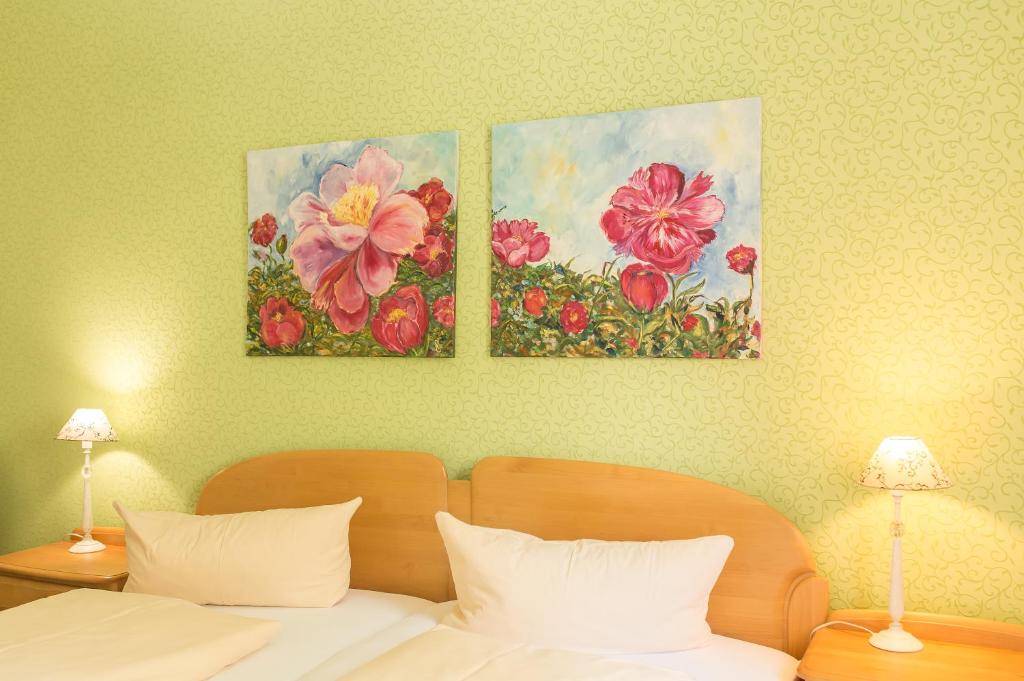Postel nebo postele na pokoji v ubytování Hotel Leander