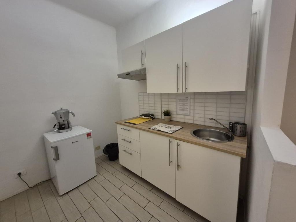 Kuchyň nebo kuchyňský kout v ubytování Il Guasco Rooms