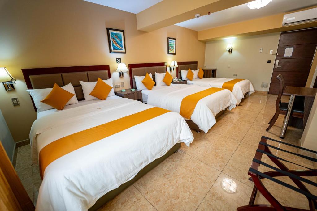 Postel nebo postele na pokoji v ubytování Gran Recreo Hotel - Trujillo - Perú