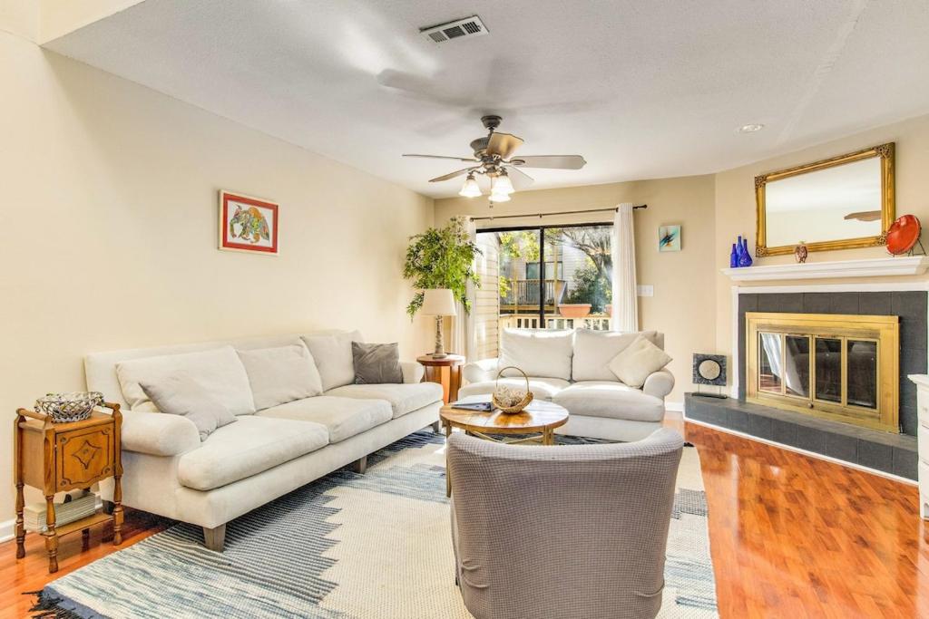 a living room with a couch and a fireplace at Sunny Large Two Bedroom Townhouse - Pool in Pensacola