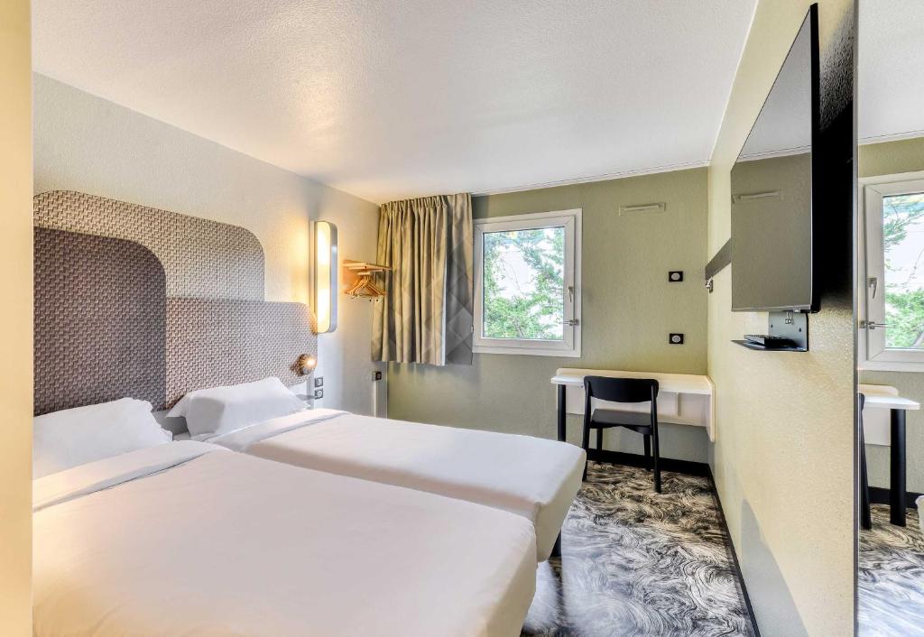 Postel nebo postele na pokoji v ubytování B&B HOTEL Montpellier Sud Lattes