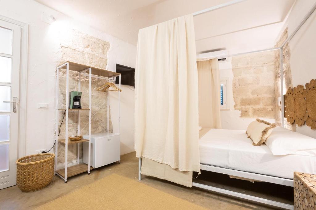 Postel nebo postele na pokoji v ubytování Rada room&suite