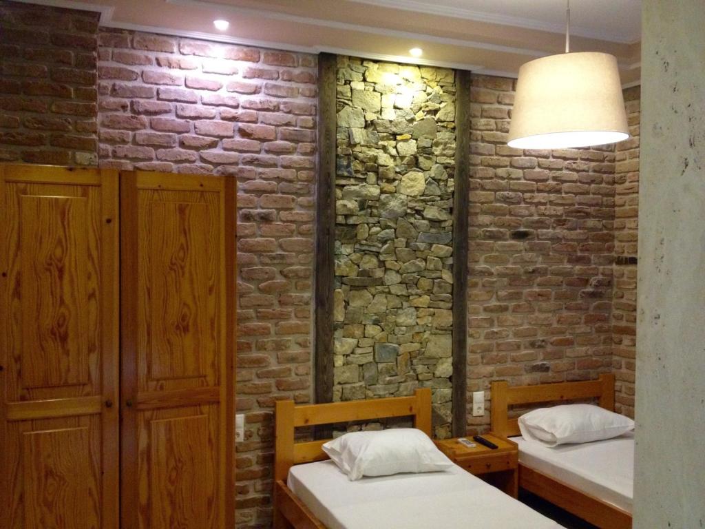 Postel nebo postele na pokoji v ubytování Menis Haus Rooms