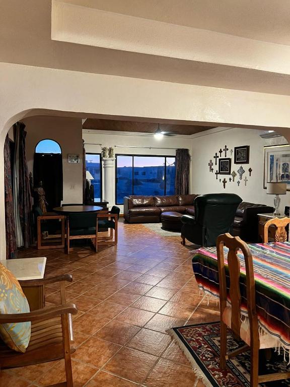 a living room with a couch and a table at The House of Angels in Las Conchas