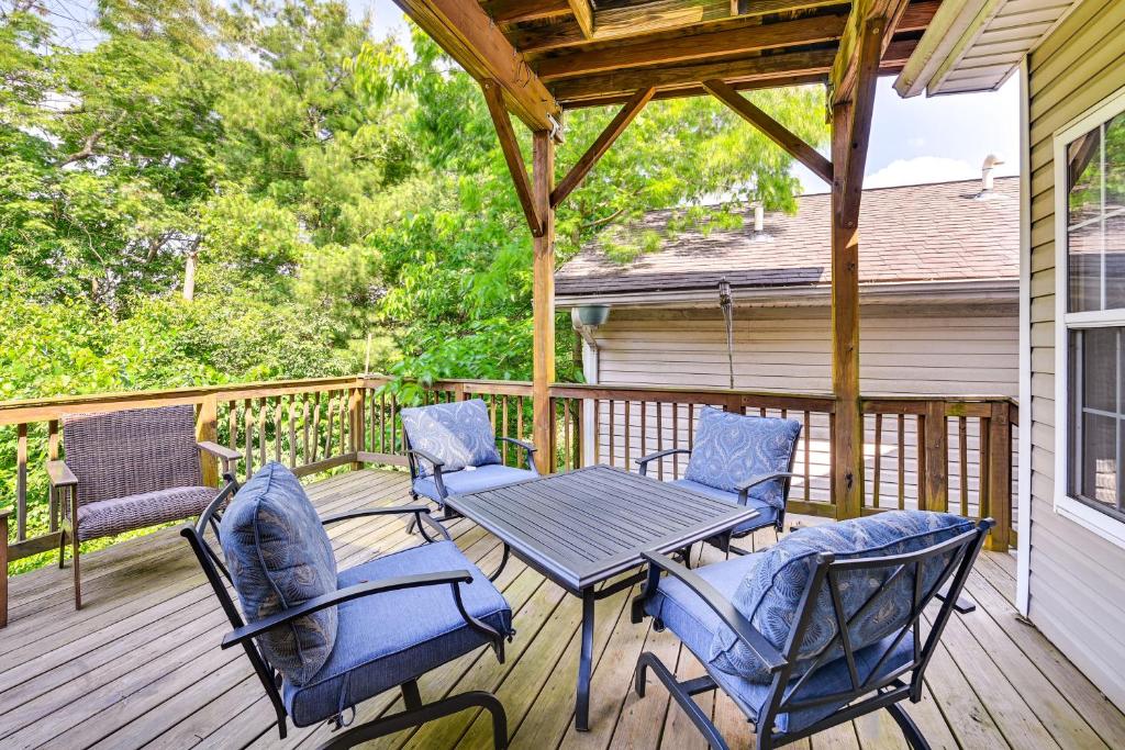 a deck with a table and chairs on a porch at 10 Mi to Keeneland Family Home with Deck and Yard in Lexington