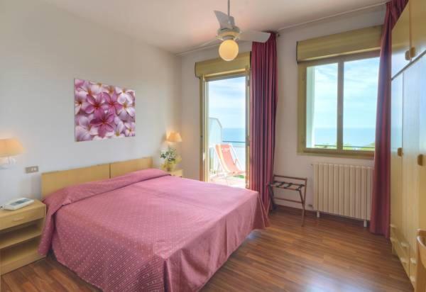 Postel nebo postele na pokoji v ubytování Hotel Eden Gigli
