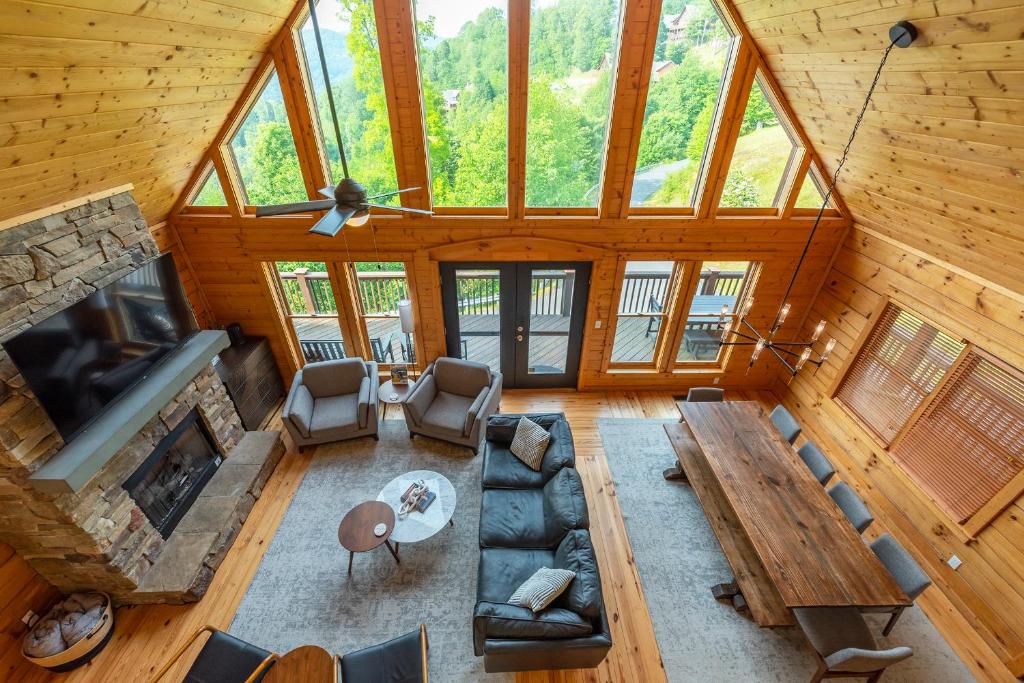 an overhead view of a living room with a fireplace at Whiskey Hills - Newly Remodeled Luxury Cabin with Hot Tub, Incredible Views close to Asheville, walk to Hatley Pointe & Ski! in Swiss
