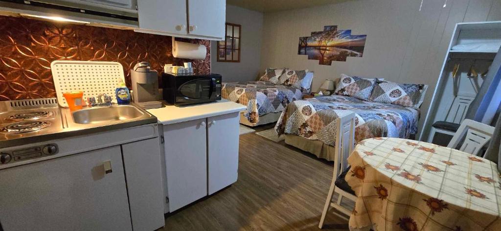 Kuchyň nebo kuchyňský kout v ubytování Motel Leblanc