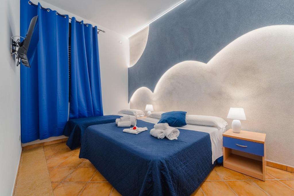 Postel nebo postele na pokoji v ubytování "L'Oasi di Favignana" Room and Charme