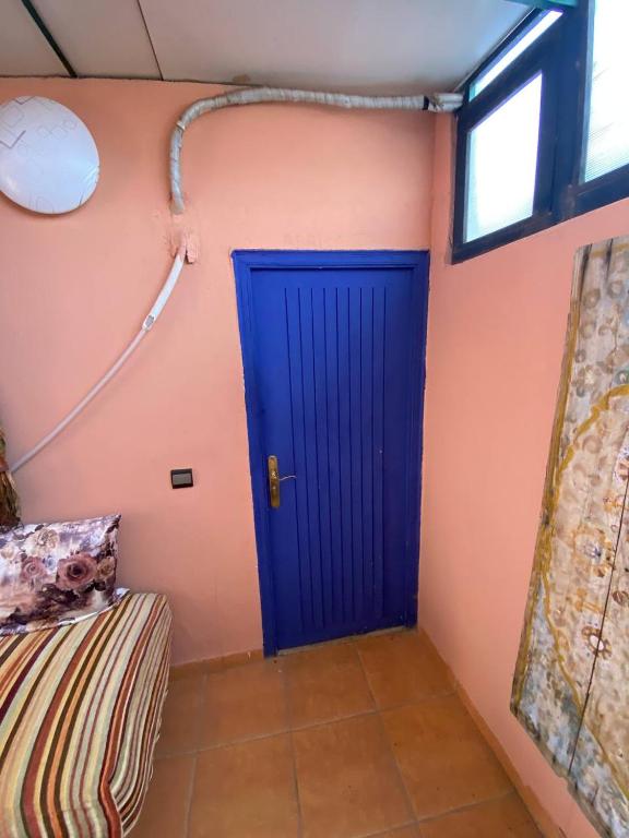 Postel nebo postele na pokoji v ubytování Riad La Rose Des Sables