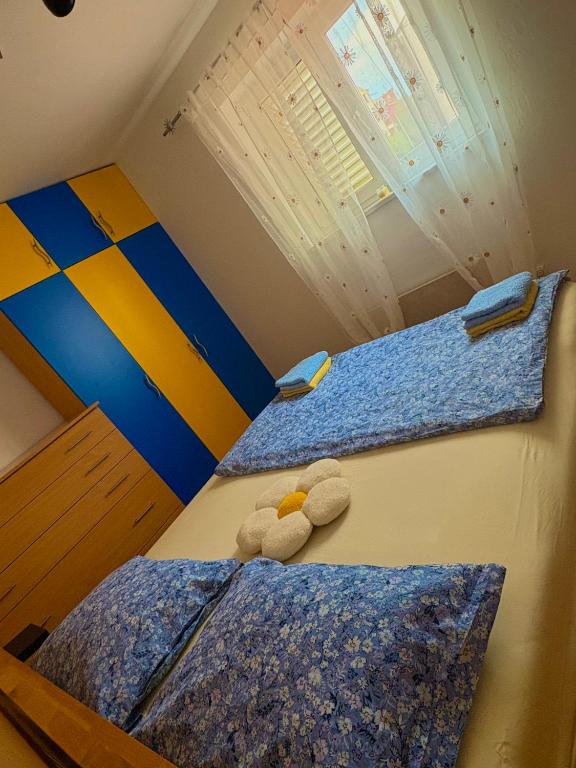 Postel nebo postele na pokoji v ubytování Apartment Teleferica Rabac