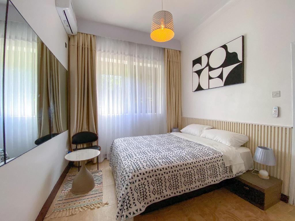 Postel nebo postele na pokoji v ubytování kololo's gem