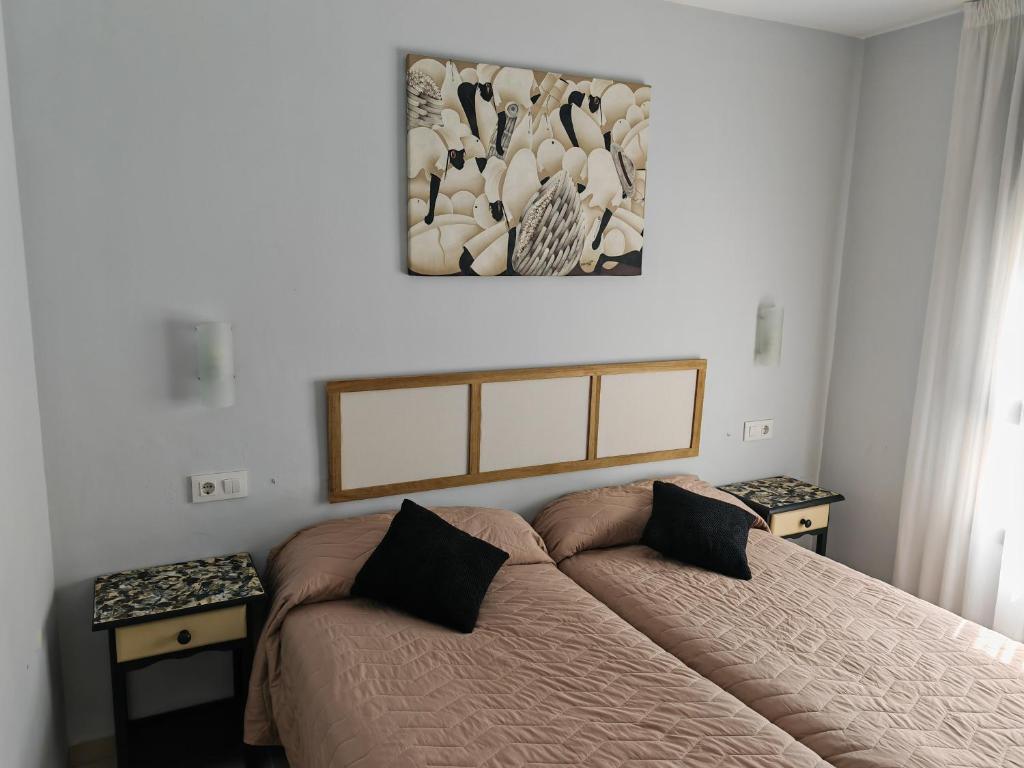 Postel nebo postele na pokoji v ubytování HOSTAL RIGAU