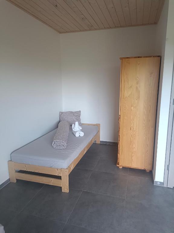 Postel nebo postele na pokoji v ubytování Agroturystyka Żuczek nad jeziorem