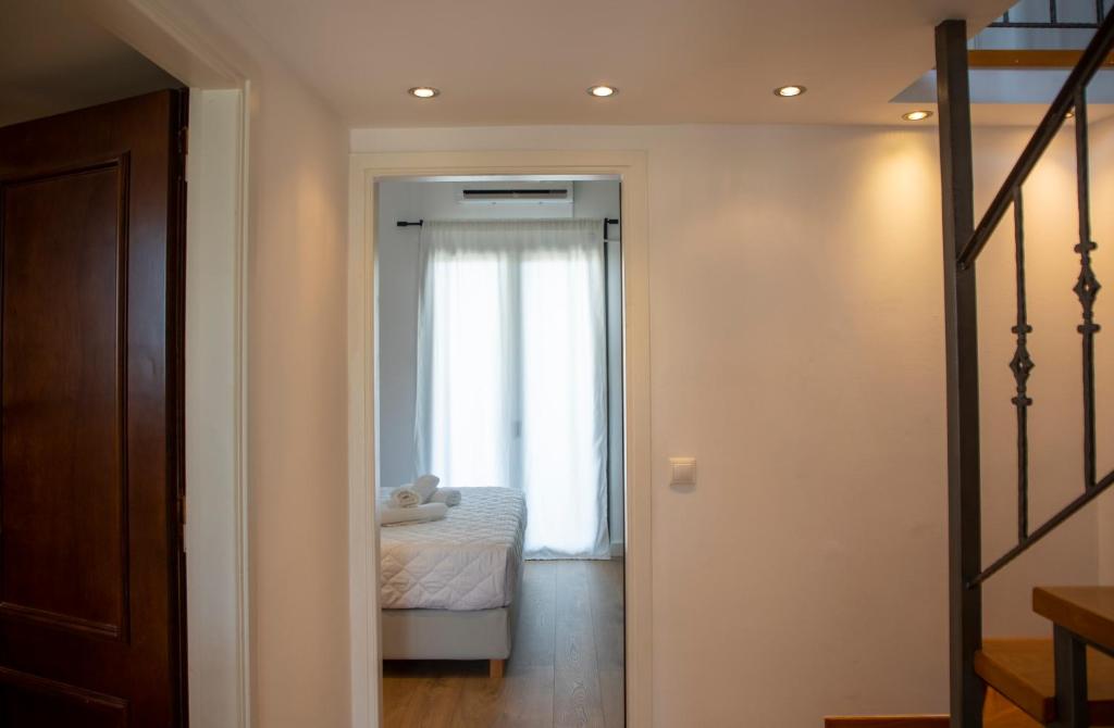 Postel nebo postele na pokoji v ubytování Aetheris Home
