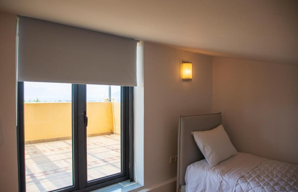Postel nebo postele na pokoji v ubytování Aetheris Home