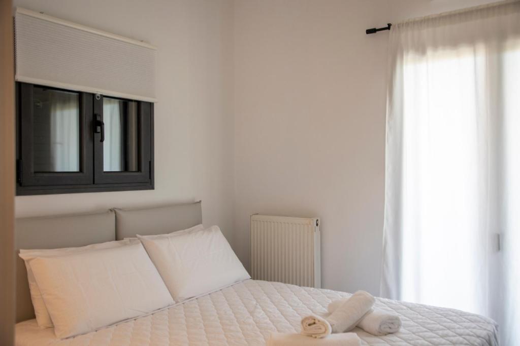 Postel nebo postele na pokoji v ubytování Aetheris Home