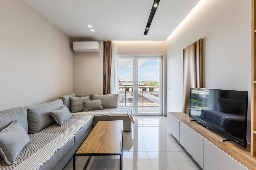 Televisyen dan/atau pusat hiburan di Olivia's Apartments