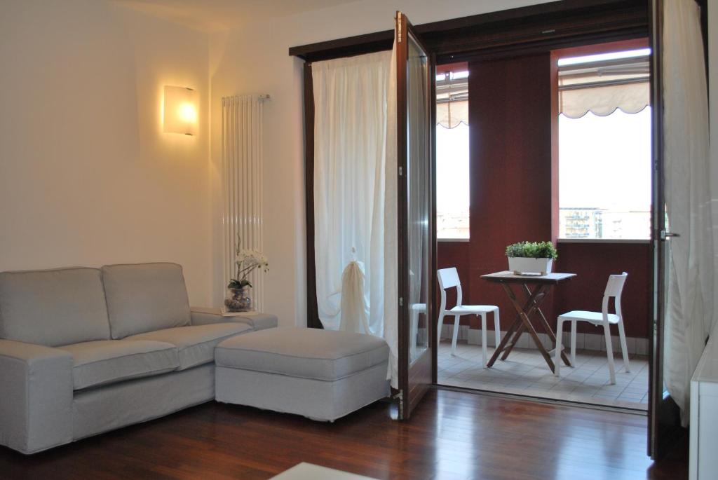 a living room with a couch and a table at Lovely Apartment Verona in Verona