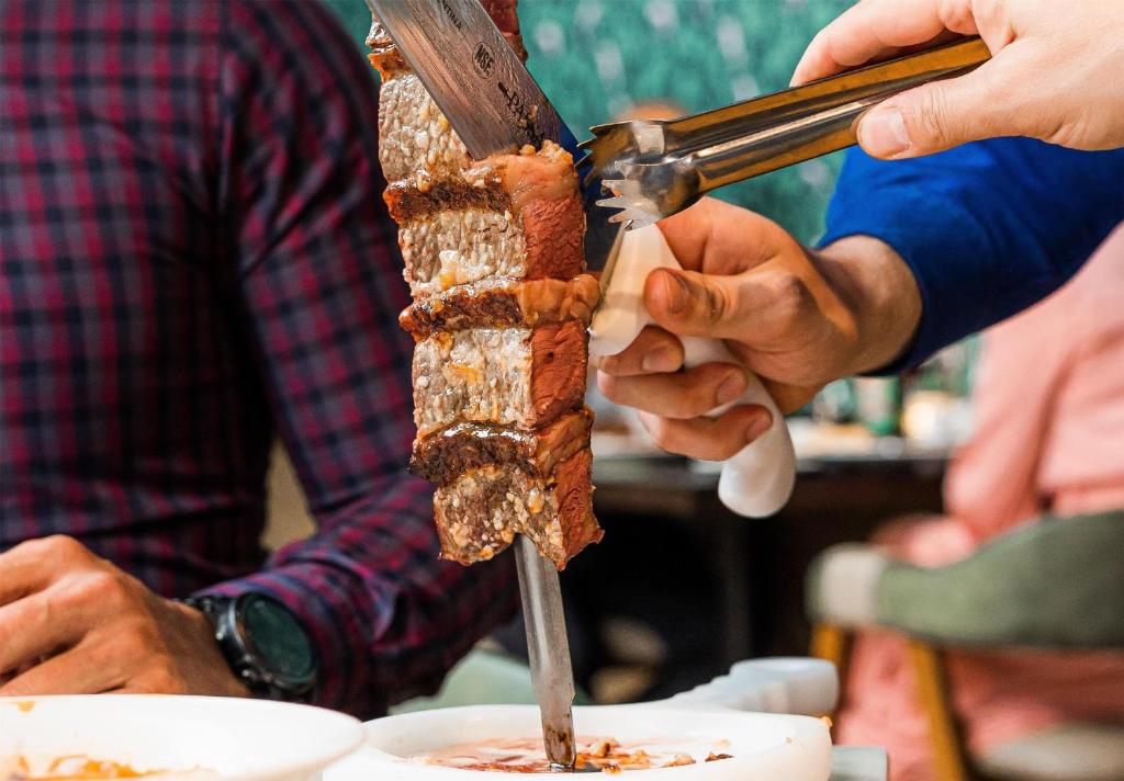 a group of people preparing food on a table at Hilton Niagara Falls/ Fallsview Hotel and Suites in Niagara Falls