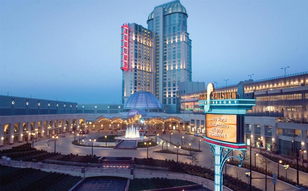 a city with tall buildings and a fountain in a courtyard at Hilton Niagara Falls/ Fallsview Hotel and Suites in Niagara Falls