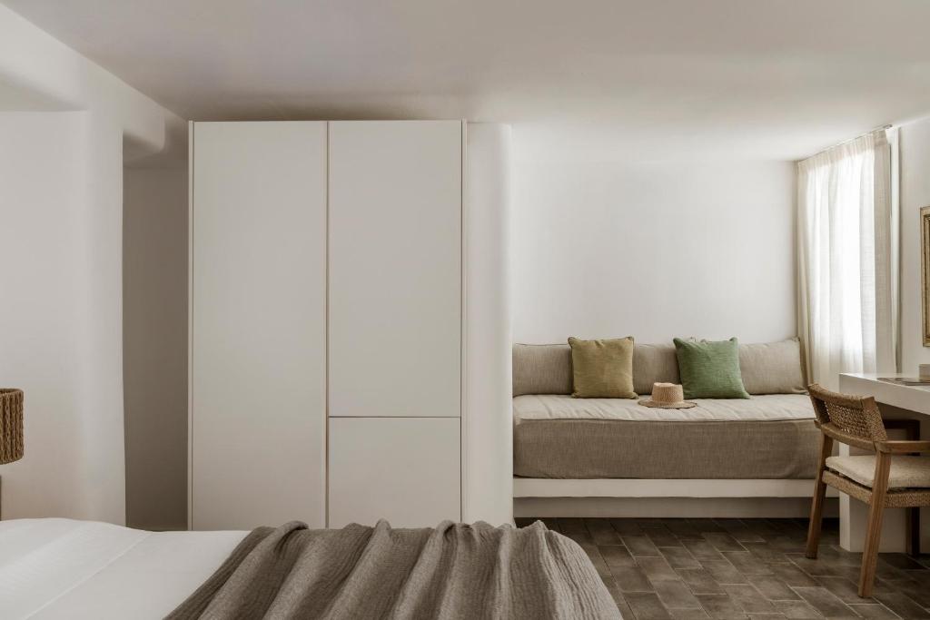 Postel nebo postele na pokoji v ubytování Gerofinikas Boutique Hotel