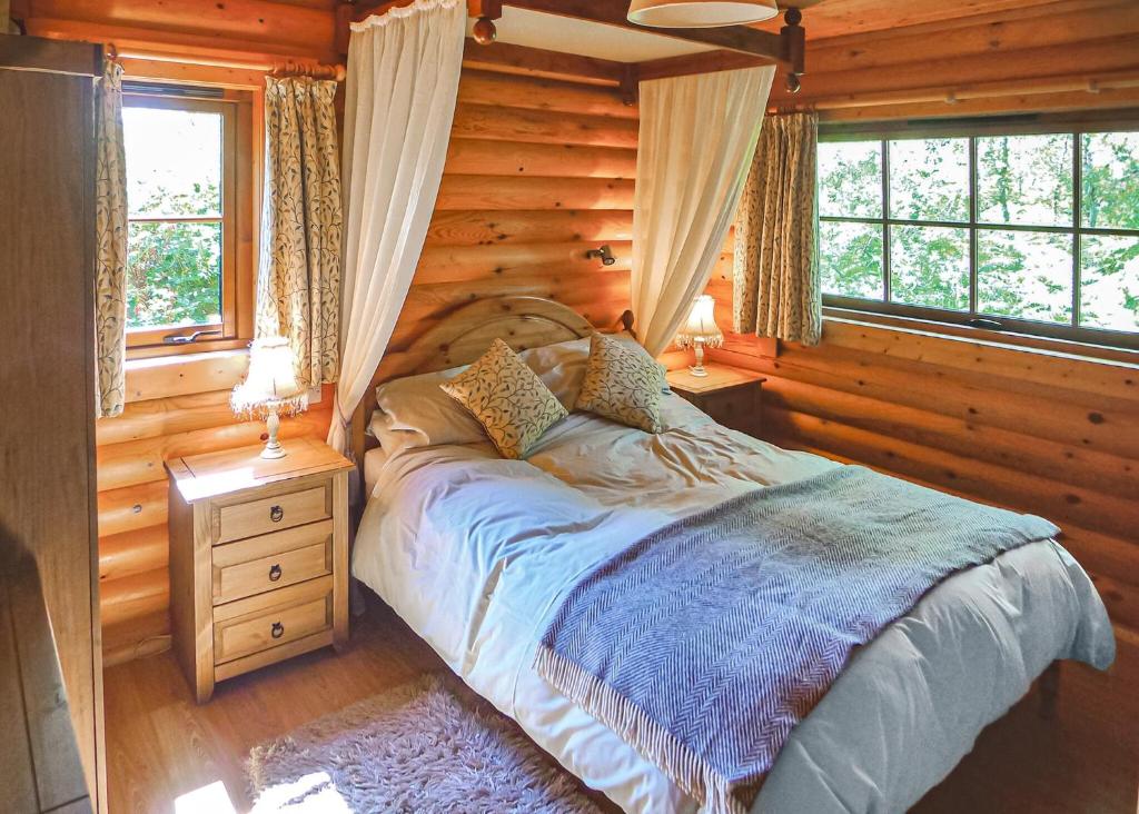 Postel nebo postele na pokoji v ubytování Loch Shuna Lodges