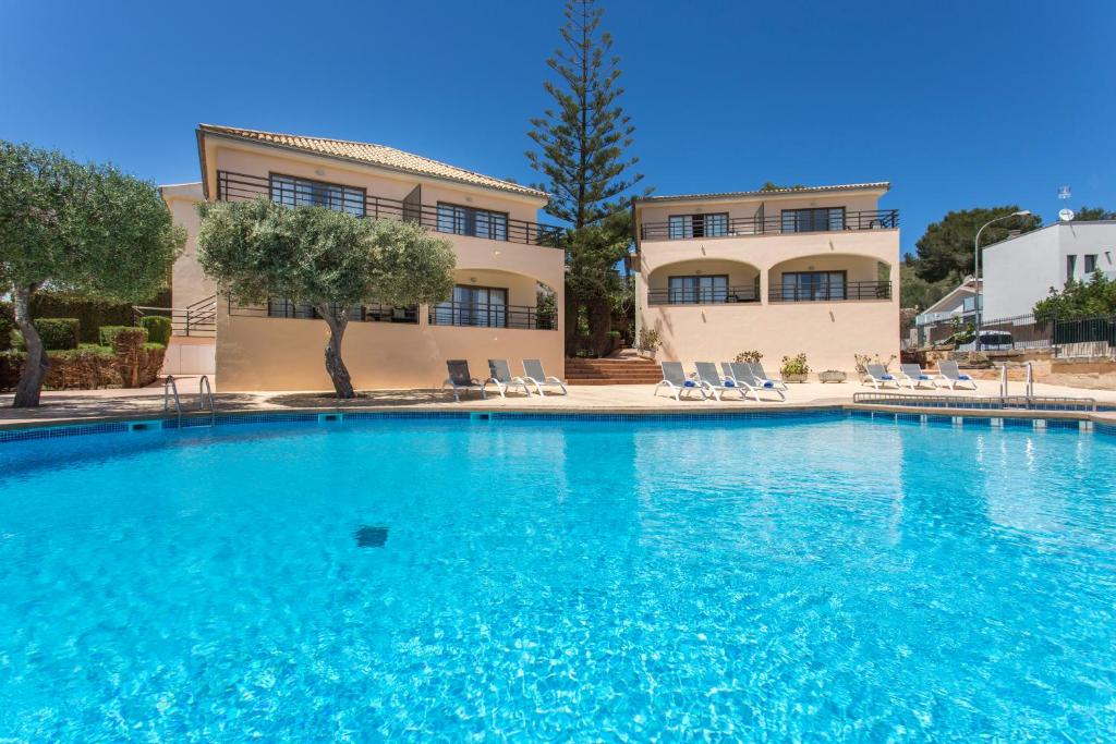 a large swimming pool in front of a building at Mar Hotels Alcanada in Port d'Alcudia