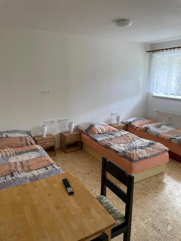 Postel nebo postele na pokoji v ubytování Apartmány J L A
