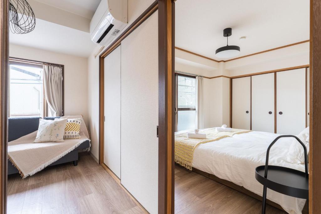 Llit o llits en una habitació de perfect life緑橋