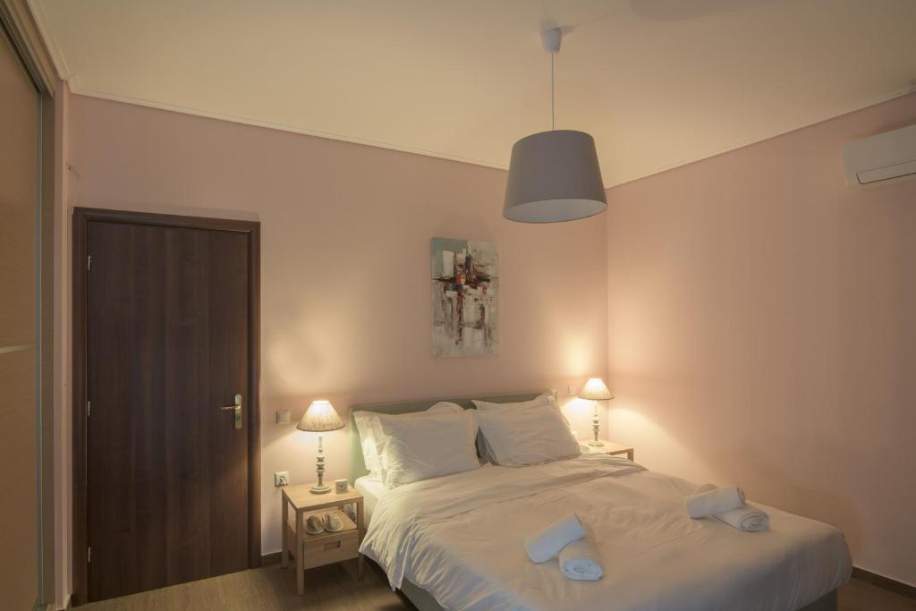 Łóżko lub łóżka w pokoju w obiekcie Petra Luxury Rooms and Apartments
