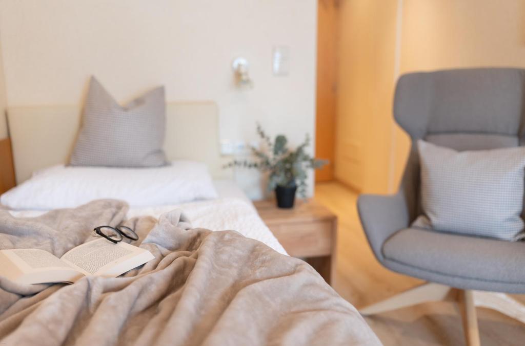 Postel nebo postele na pokoji v ubytování Hotel Nocker