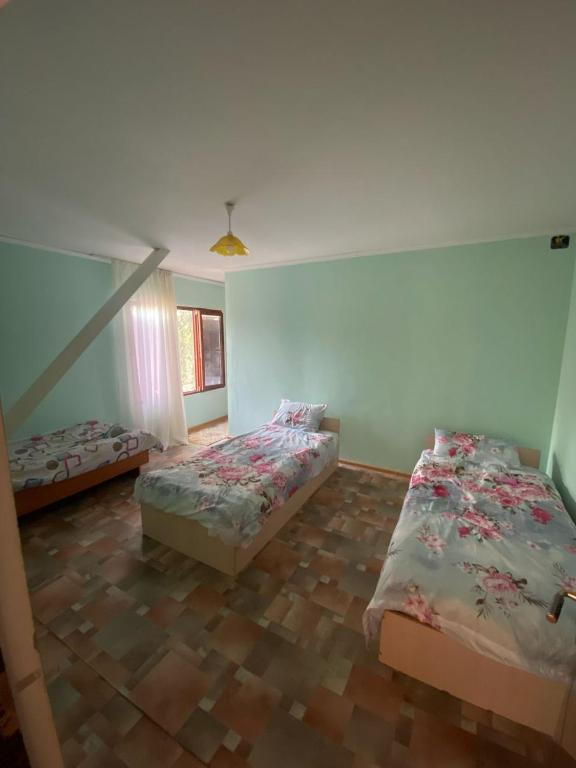 Postel nebo postele na pokoji v ubytování Шанхай
